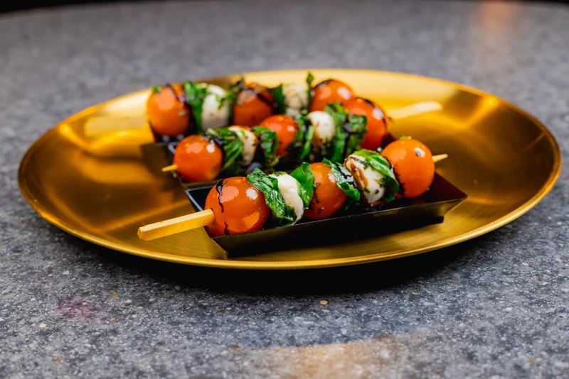 Caprese skewers plated on gold